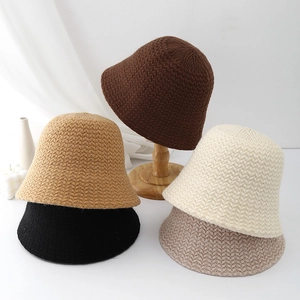 Chic knitted bucket hats for women in neutral colors like black, beige and brown