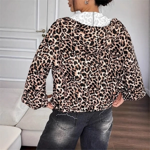Detail of hooded leopard print jacket showing elastic hem and back silhouette