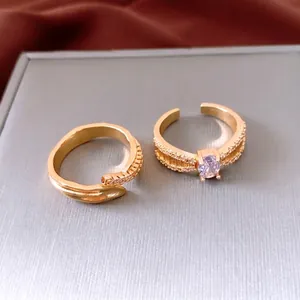 Vintage gold adjustable ring set with purple zircon stone and pavé crystal details