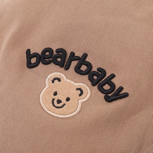Brown knit baby bear hat with bearbaby embroidery and plush teddy bear patch