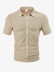 Detail showing knit texture and fabric label on khaki short sleeve polo shirt