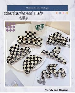 Close-up of checkerboard shark hair clips in six geometric shapes for women