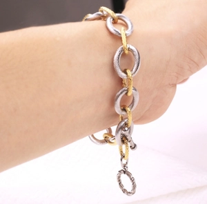 Two-tone textured titanium steel chain bracelet with OT toggle clasp on wrist