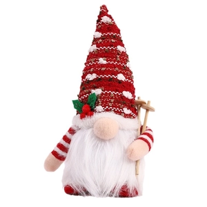 Lighted Christmas gnome plush with red polka dot hat and wooden ski poles on white background