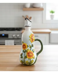 Detail of sunflower ceramic oil dispenser with automatic spout on a kitchen counter