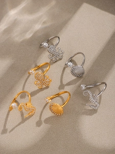 Macro detail of six ocean-themed adjustable rings with sparkling zircons and sea motifs