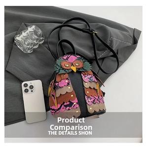 Detail showing the creative owl-shaped PU leather bag with multi-color leather patchwork