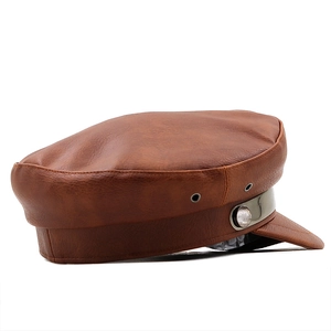 Detail of caramel brown PU leather military hat featuring metallic air vents and side button