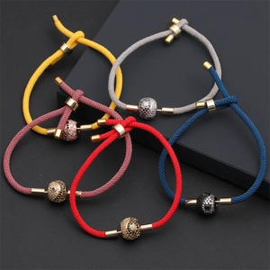 Adjustable woven cord bracelets in vibrant colors with gold-tone zircon center beads