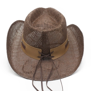 Close-up of dark brown woven straw cowboy hat with wide brim and leather band detail