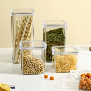 Set of transparent plastic food storage containers with white airtight locking lids