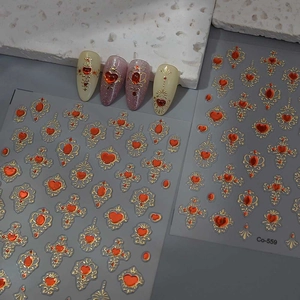 Baroque style nail art stickers with red heart gems and vintage gold cross patterns