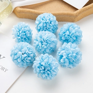 Close-up of eight sky blue artificial silk hydrangea heads on a white background