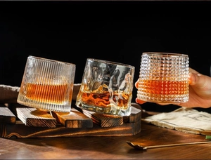 Detailed view of rotating whiskey glasses with vertical, ice-crack and diamond textures