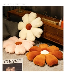 Detailed close-up of plush flower pillows in white, pink, and orange-brown for home decor