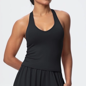 Detail view of the V-neck racerback sports top and pleated tennis skirt in black