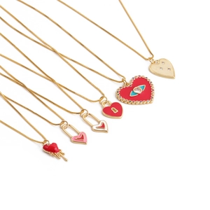 Golden chain necklaces with heart-shaped evil eye enamel pendants and crystals