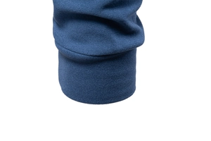 Detailed close-up of dark blue elastic ribbed cuff on men's thermal half-zip sweatshirt