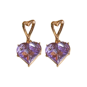Elegant gold plated heart earrings featuring purple zircon crystals on a white background