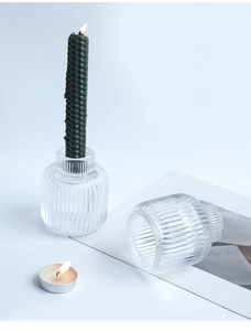 Detailed view of the vertical ribbed glass candle holder with elegant transparent texture