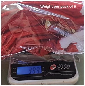 Detailed view of 6-pack red Christmas chair covers in packaging weighing approx 399g