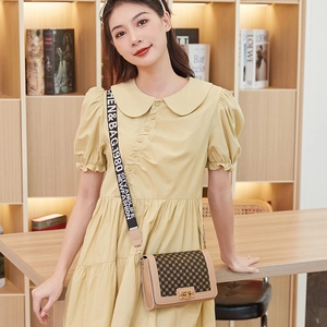 Retro beige leather crossbody bag with geometric print and a wide canvas strap