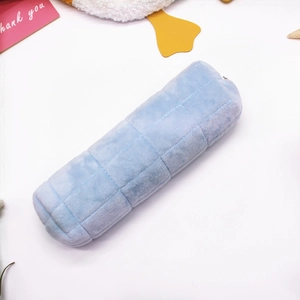 Light blue quilted plush pencil case with zipper closure on a white aesthetic background