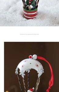 Detail of red and white Nordic iron hot air balloon ornament with holiday greetings