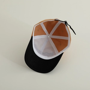 Internal view of a cotton baseball cap featuring six-panel stitching and adjustable drawstring