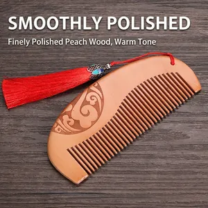 Handcrafted thick peach wood comb with traditional carving and red tassel pendant