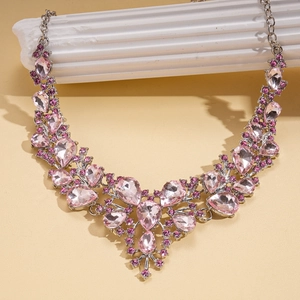 Detail of luxury teardrop floral necklace with pink crystals on white column