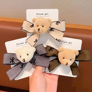 Sweet plush bear bow hair clips in beige, grey, and brown colors for girls' hair styling