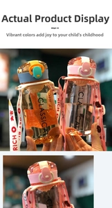 Close-up of clear plastic water bottles with colorful printed straps and ring lids