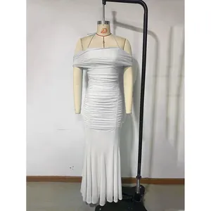 Detail of silver sequined evening gown featuring off-shoulder neckline and ruched texture