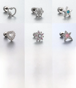 Detail view of 6 silver titanium steel stud earrings with heart, star, and flower shapes