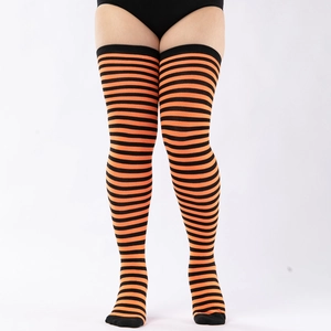 Detail of orange and black striped over-the-knee socks showing stretch and elastic fit
