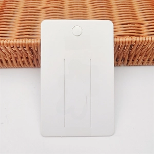 White cardboard accessory display card with a pink bear outline and Hello text