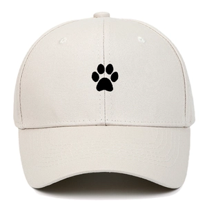 Close-up of the black paw embroidery on the premium beige cotton baseball cap