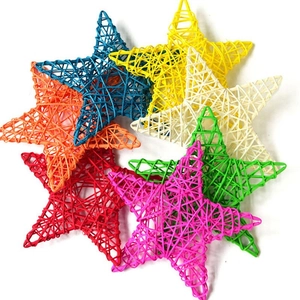 Colorful handmade wicker star decorations in various vibrant hues for festive window display