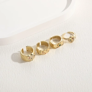Set of four geometric 14K gold plated rings with colorful cubic zirconia accents