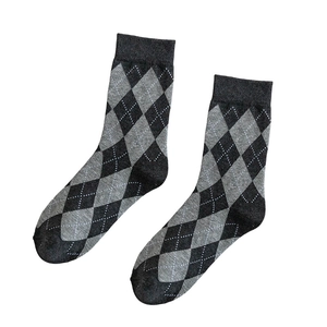 Classic dark grey and black argyle patterned cotton crew socks for women on white background