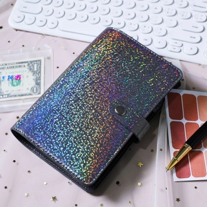 Macro view of A6 laser glitter leather binder with snap closure and colorful sequins