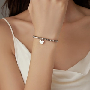 Minimalist silver beaded bracelet featuring a heart-shaped pendant for women daily wear