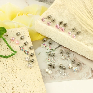 Set of 12 pairs of fashion stud earrings with colorful zircon and pearls on stone base