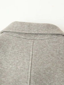 Close-up of the double-layer collar and fine wool blend texture on the grey coat back