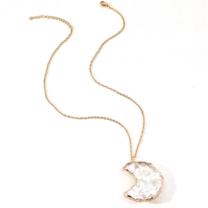 Golden necklace with natural white crystal moon pendant on a clean white background