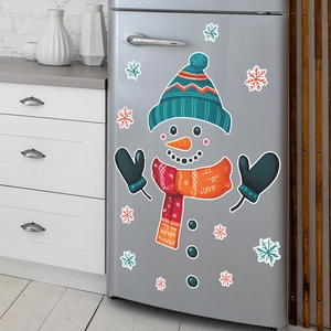 Christmas snowman fridge magnets with blue hat and red scarf on silver refrigerator