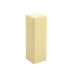 Vertical rotating butter spreader stick in pale yellow plastic for kitchen and baking