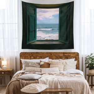 Detailed view of bohemian wall tapestry featuring a seaside window view in a cozy bedroom