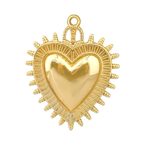Close-up of gold-plated heart pendant with crown and spike details for DIY jewelry